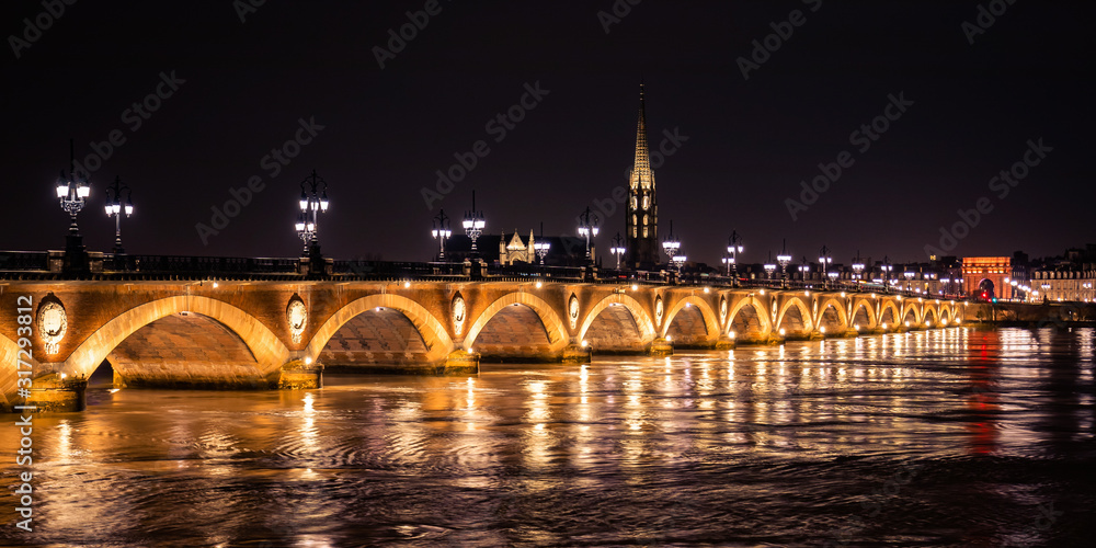 Bordeaux skyline at night with the Pont de Pierre bridge and the Garonne river