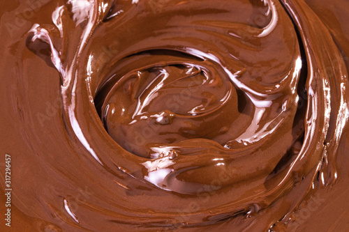 Chocolate texture. Liquid chocolate close-up.Textured dark chocolate