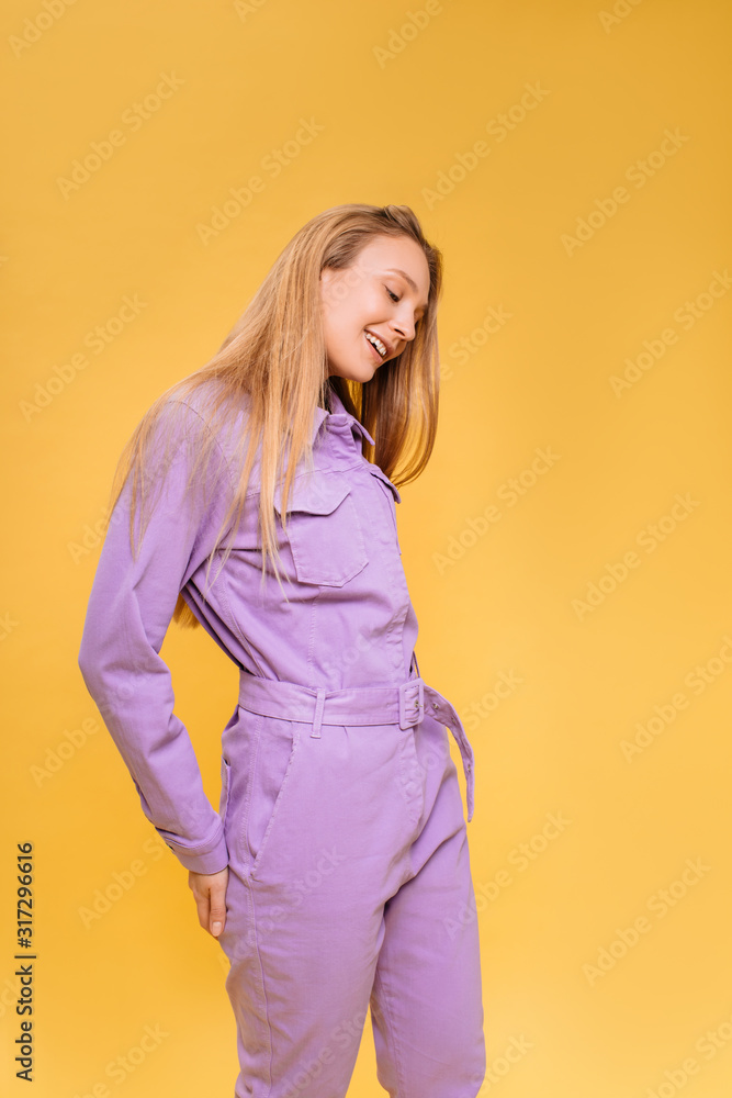 Studio portrait of gorgeous bloinde woman posing on bold background Studio portrait of gorgeous bloinde woman posing on bold background