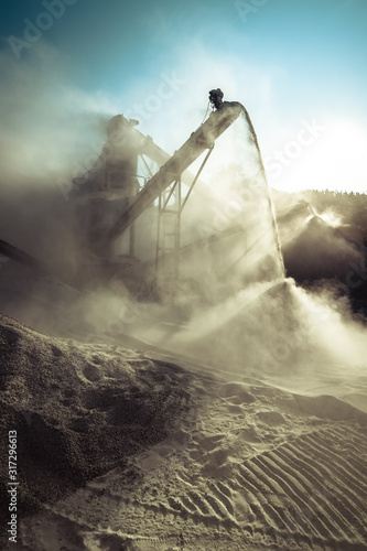 Industrial background with working gravel crusher