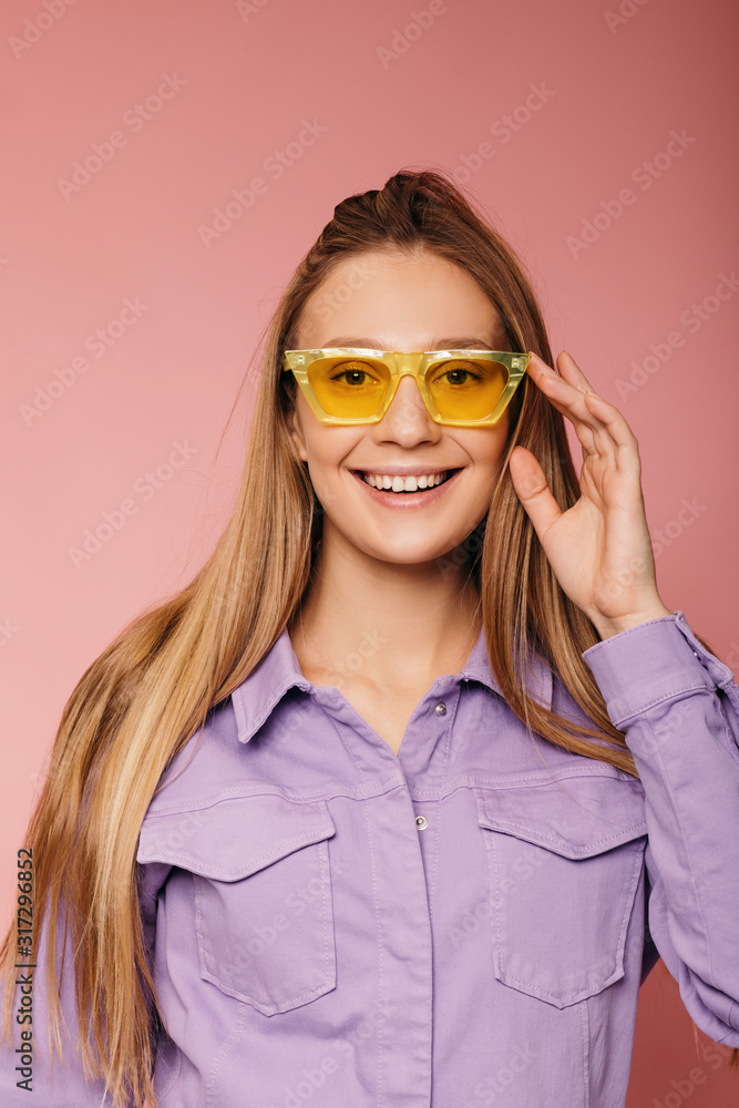 Studio portrait of gorgeous bloinde woman posing on bold background Studio portrait of gorgeous bloinde woman posing on bold background