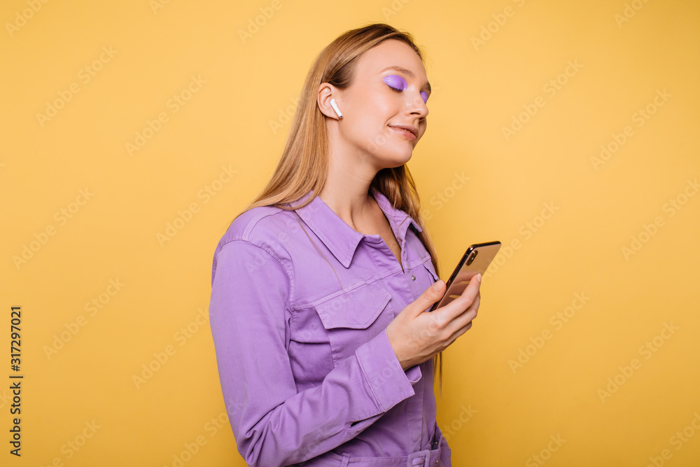 Studio portrait of gorgeous bloinde woman posing on bold background Studio portrait of gorgeous bloinde woman posing on bold background