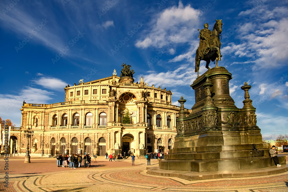 Saxon State Opera Semperoper and Statue of King Johann Konig Johann on Theaterplatz in Dresden, Germany. November 2019
