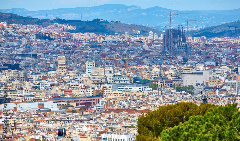 View above on Barcelona from Montjuic hill. Sagrada Familia cathedral.