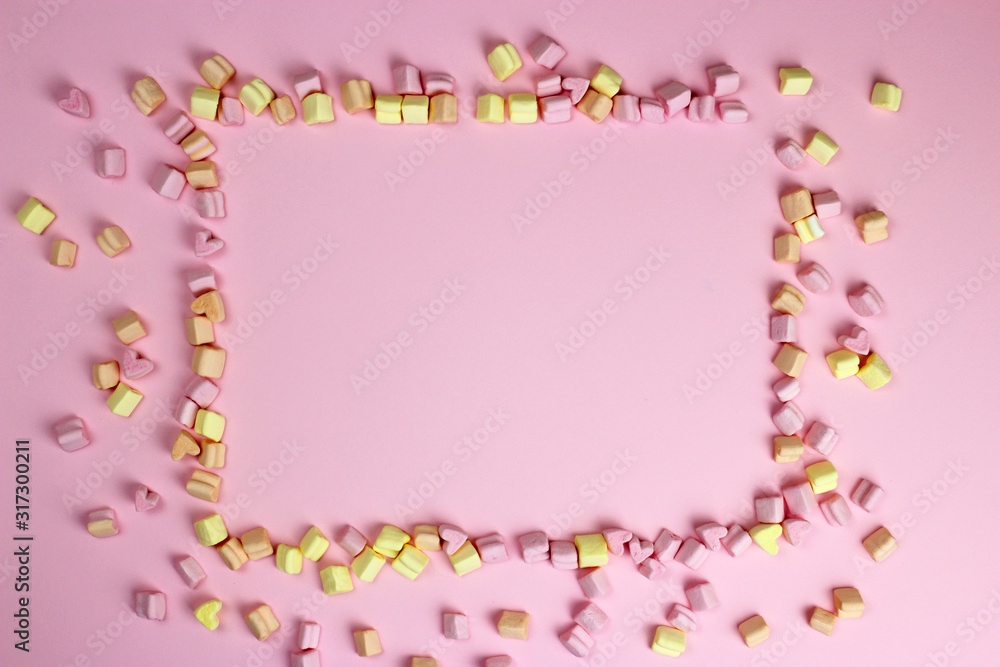 Marshmallow frame, pink background. Valentine's day, lovers, wedding. Space for text