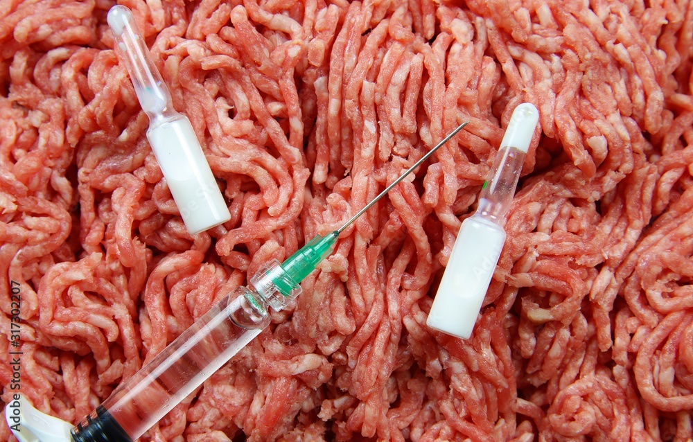Antibiotic use in food producing animals concept: two white ampules, syringe and injection needle with minced raw meat background Stock Photo | Adobe Stock Antibiotic use in food producing animals concept: two white ampules, syringe and injection needle with minced raw meat background Stock Photo | Adobe Stock