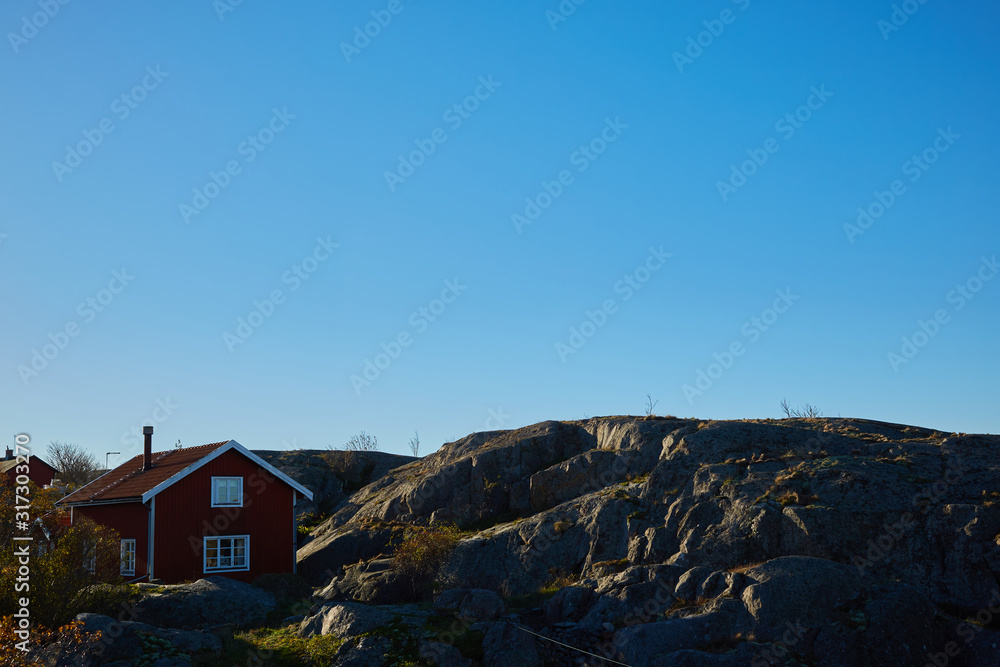Red house at sea shore in the baltic sea in dull colors in autumn. Red house at sea shore in the baltic sea in dull colors in autumn.
