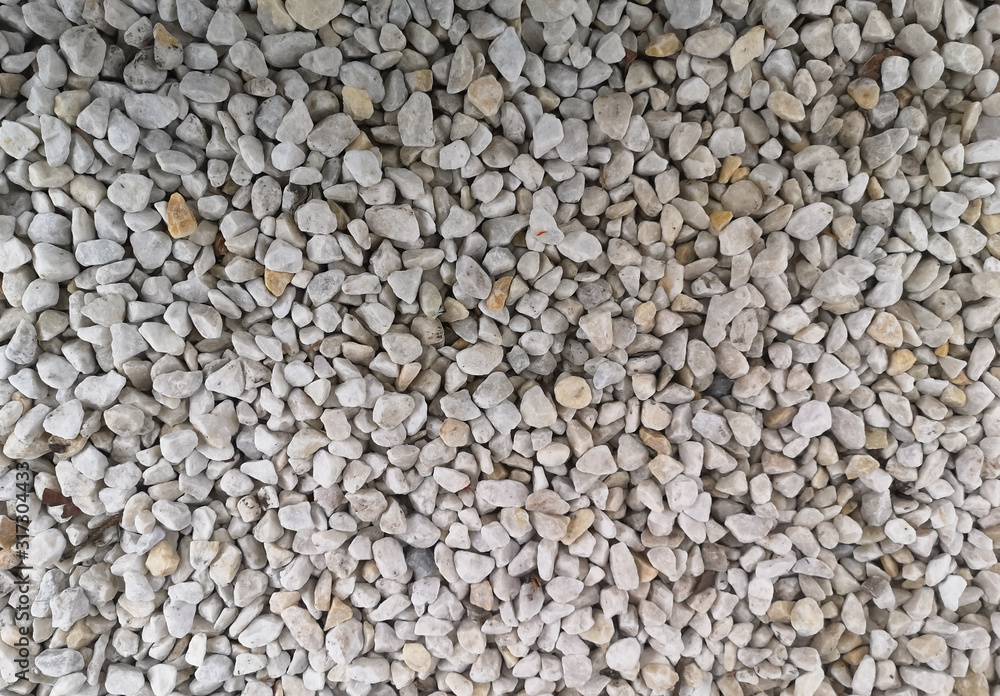 texture of many yellow and white stones. background of stone heap texture of many yellow and white stones. background of stone heap