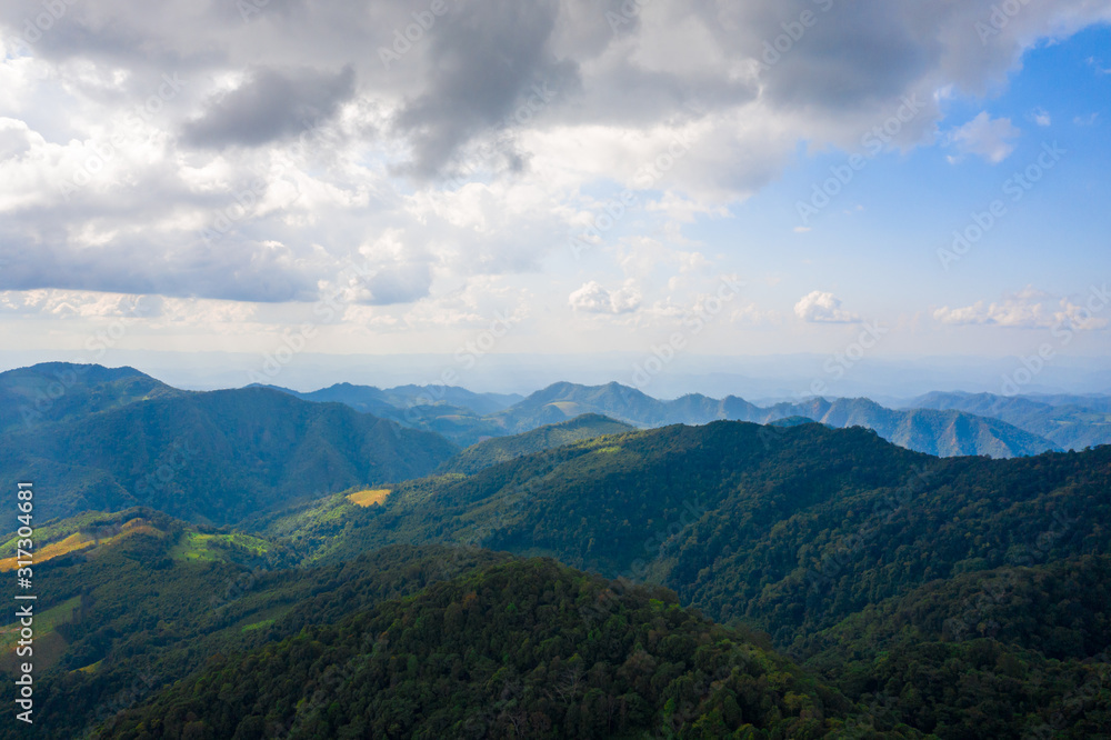 Aerial landscape of mountain and blue sky with cloud at Doi Mae U Kho, Khun Yuam, Mae Hong Son, Thailand