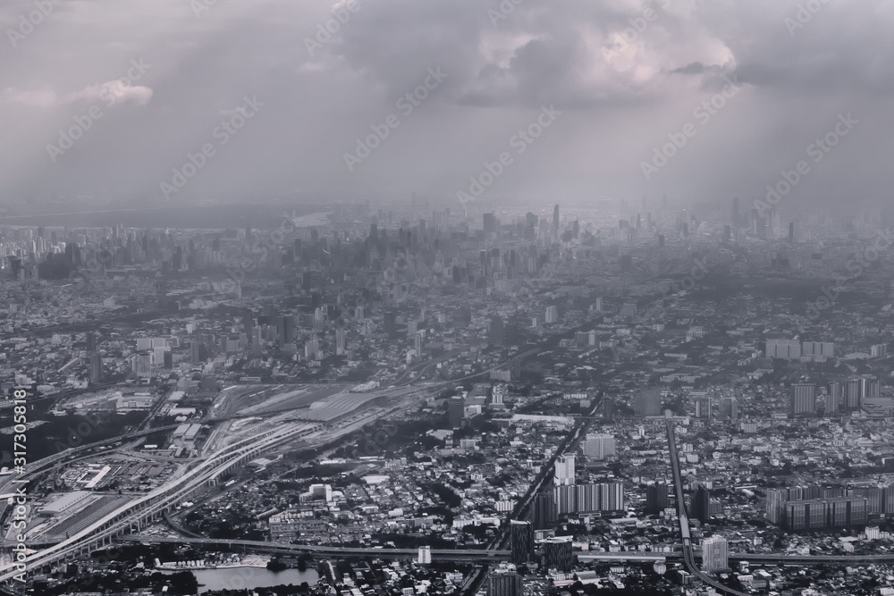 Aerial view of Bangkok, Thailand, polluted air over the horizon. Urban sprawl, metropolis. Black and white color toned vintage effect.