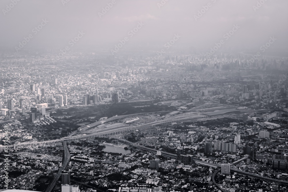 Air pollution over  Bangkok, Thailand, aerial view. Urban sprawl, metropolis. Black and white color toned vintage effect.