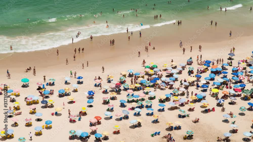People swimming and sunbathing on Copacabana beach in Rio de Janeiro, Brazi, South America - 4K Time lapse People swimming and sunbathing on Copacabana beach in Rio de Janeiro, Brazi, South America - 4K Time lapse