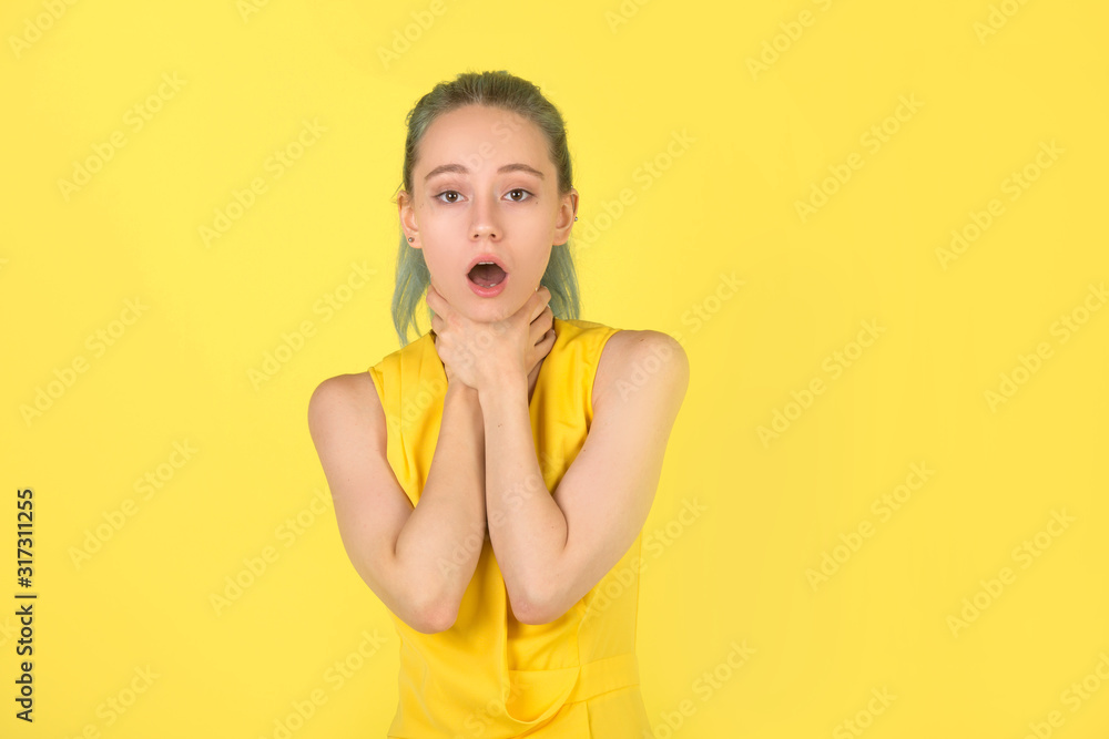 beautiful young woman in a yellow dress on a yellow background beautiful young woman in a yellow dress on a yellow background