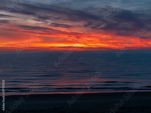 sea sunset landscape with colorful skies and dark water