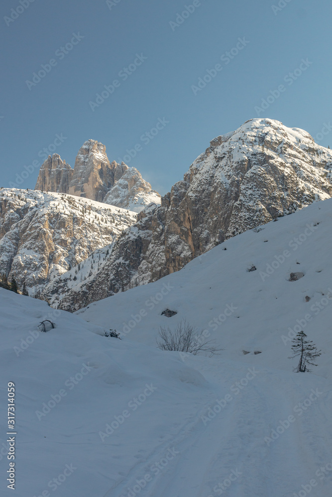 Scenic view on the famous peaks of Sexten Dolomites, The Cime Drei Zinnen di Lavaredo, on a snowy calm winter day in Trentino, Italy, Europe