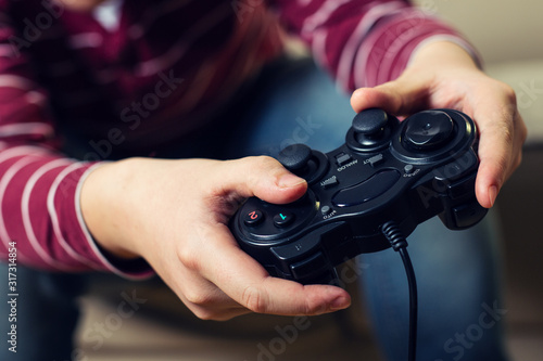 Closeup image of hands holding the game controller.