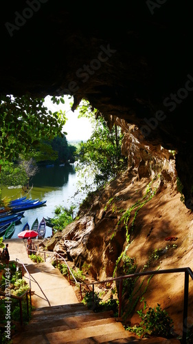 exit of famous cave in Hpa An with boats waiting for tourists, Myanmar, Asia photo