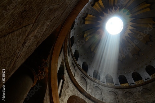 Low angle shot of the light coming from the ceiling in a historic Cathedral i...