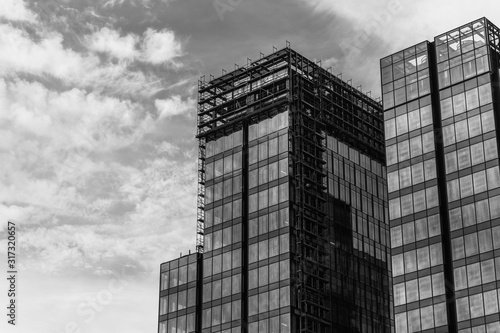 Office buildings. modern glass and concrete silhouettes of skyscrapers. Black and white background.
