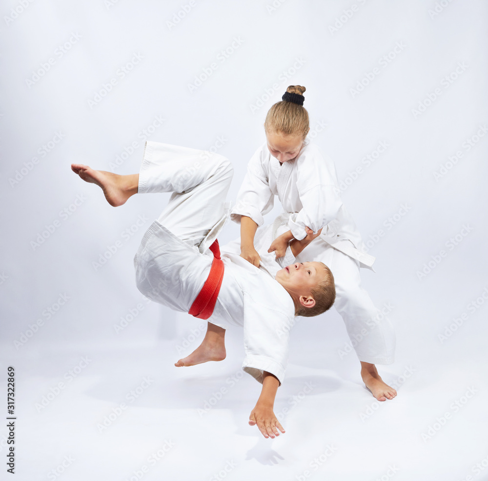 Little sportswoman is doing judo throw Little sportswoman is doing judo throw