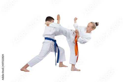 Athletes train blocks and kicks of karate