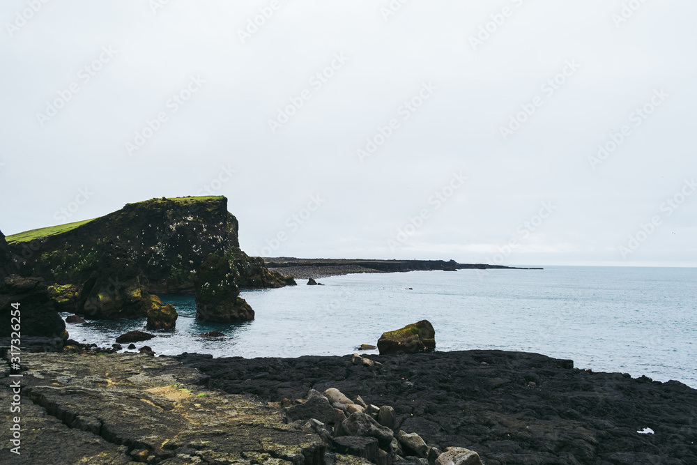 Beautiful view of Icelandic cliffs by Atlantic Ocean