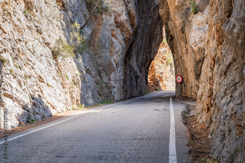 Road with tunnel through the rocks. Majorca island, Spain