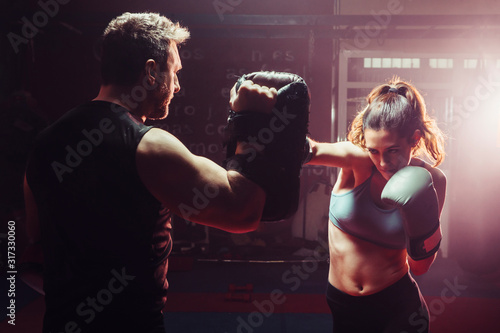 male trainer gives self-defense classes to female fighter - stra