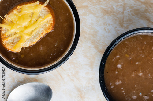 French onion soup with cheese topped croutes photo