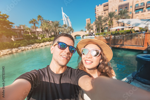 Photography Tourism and holiday resorts - a couple in love during their honeymoon taking a s