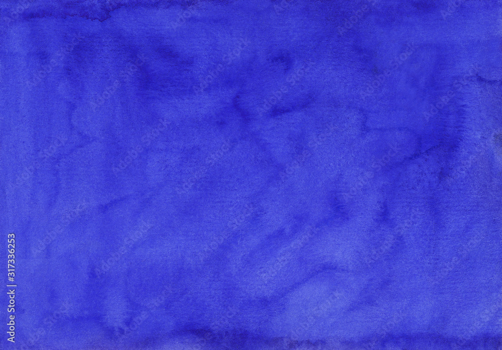 Watercolor deep royal blue background texture hand painted.  Aquarelle blue stains on paper.