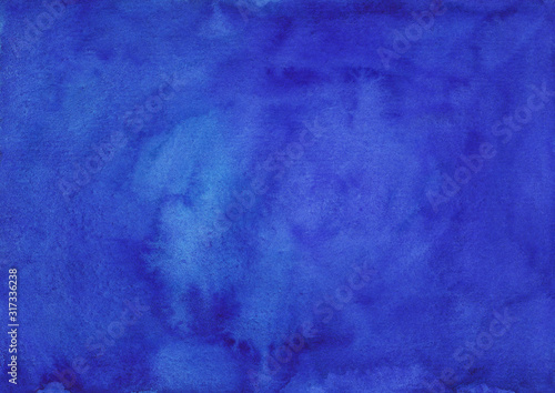 Watercolor deep lapis blue background texture hand painted.  Watercolour blue violet stains on paper. photo