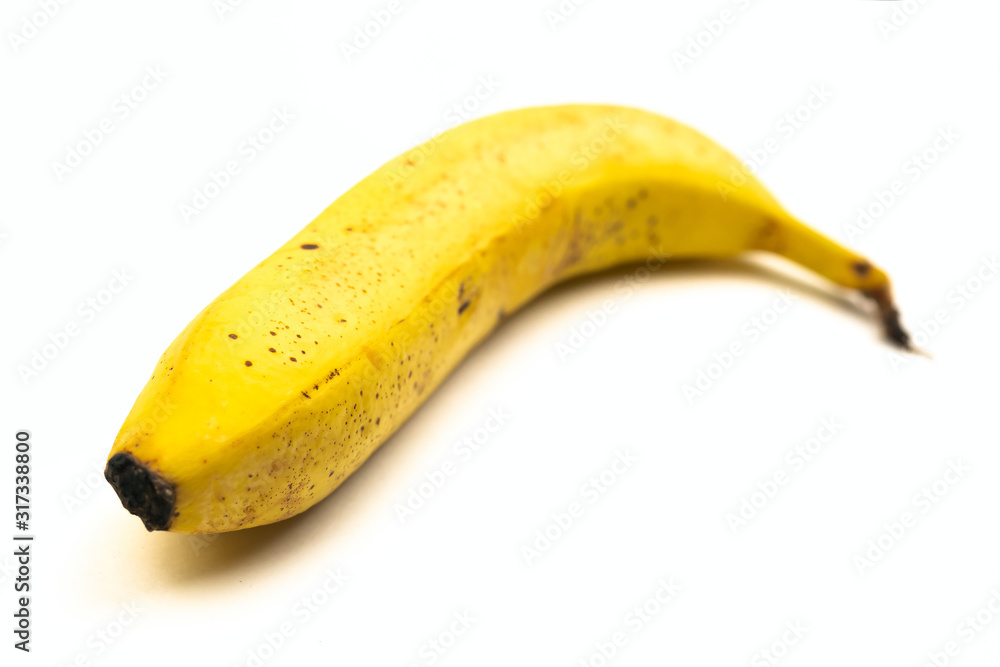 Ripe yellow banana isolated on white background. Selective focus. Ripe yellow banana isolated on white background. Selective focus.