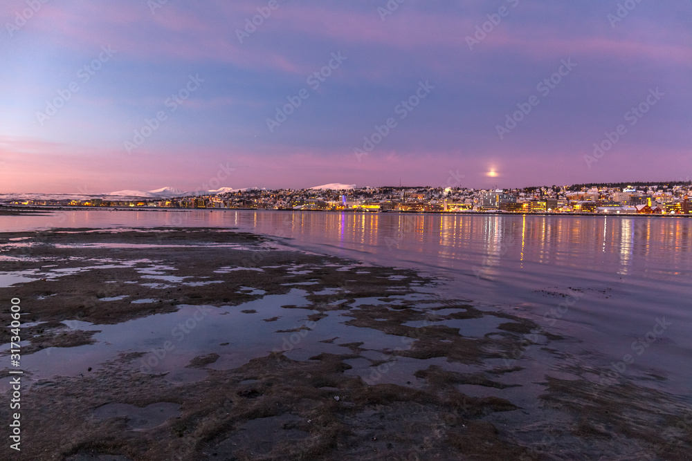 Amazing sunrise with amazing magenta color over Tromso, Norway. Polar night. long shutter speed