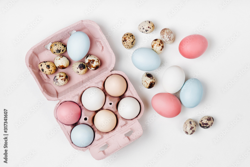 Natural Colored brown and white Eggs in egg box. Compositions in pastel colors. Easter consept. Flat lay, top view Natural Colored brown and white Eggs in egg box. Compositions in pastel colors. Easter consept. Flat lay, top view