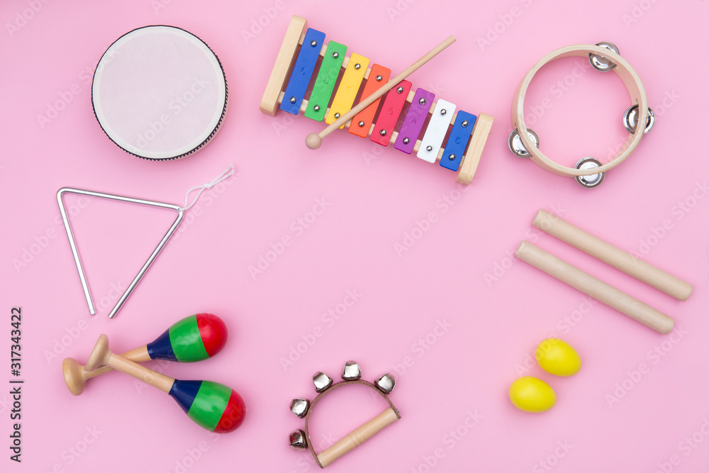 Musical instruments on pink background