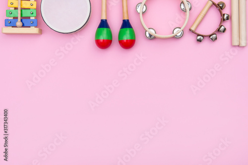 Musical instruments on pink background