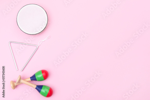 Musical instruments on pink background