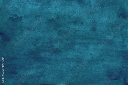 Watercolor peacock blue background texture, stains on paper. Hand painted dark blue watercolour backdrop.