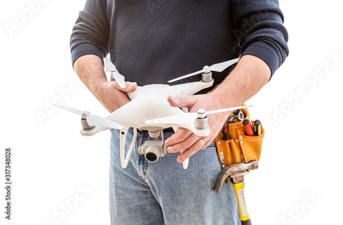 Construction Worker and Drone Pilot With Toolbelt Holding Drone Isolated on White Backround