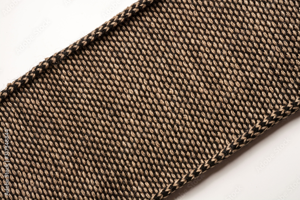 custom made wallpaper toronto digitalFragment of knitted scarf of brown-black color with twisted edges. Diagonal location on a white background