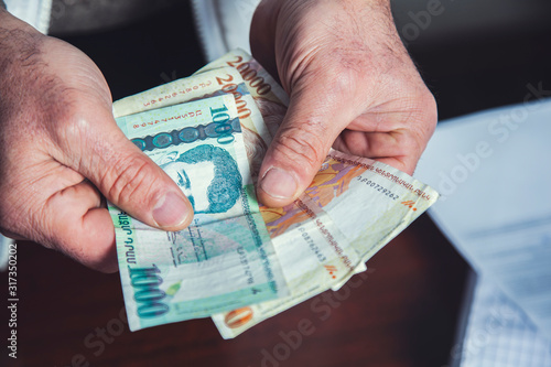man hand holding money