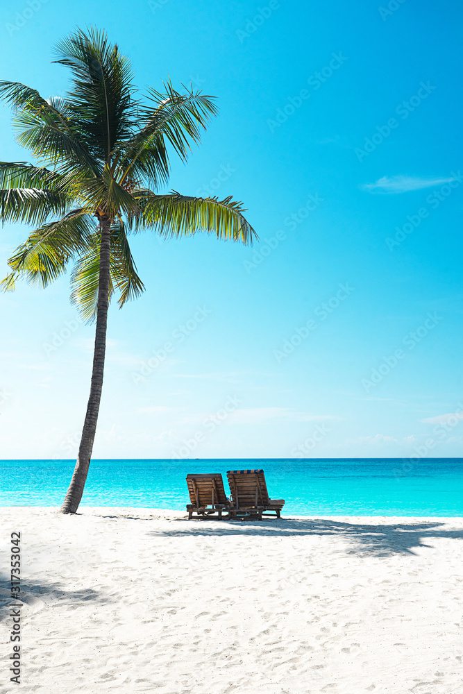 Panoramic view of a beautiful sunny day on sandy beach on exotic island.
