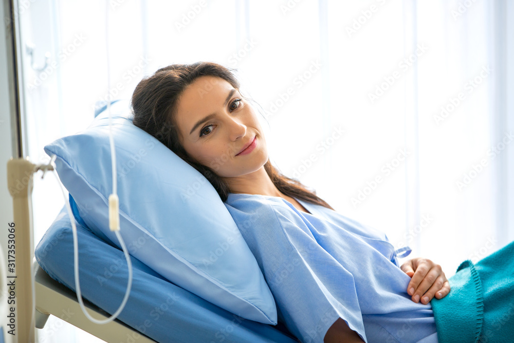 women patient lying on bed in hospital women patient lying on bed in hospital