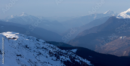 Courchevel view valley dust mood sunset with snowy mountain landscape France alpes