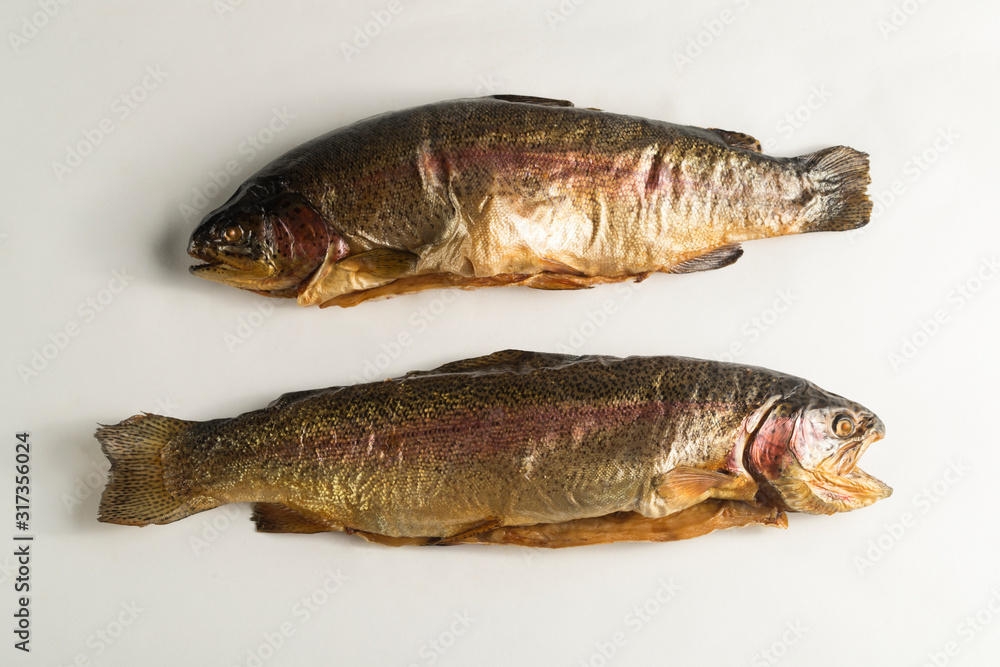 Cold smoked rainbow trout on a white background