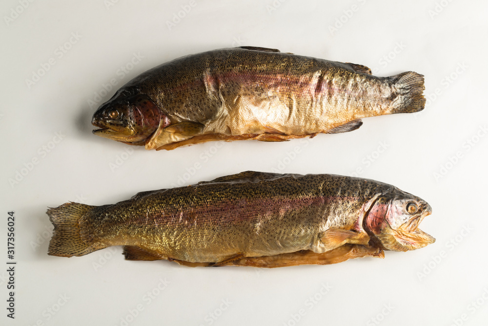 Cold smoked rainbow trout on a white background Cold smoked rainbow trout on a white background