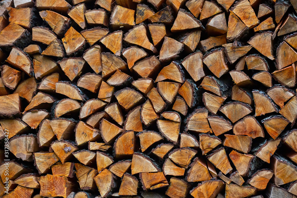 Chopped firewood neatly stacked, texture background Chopped firewood neatly stacked, texture background