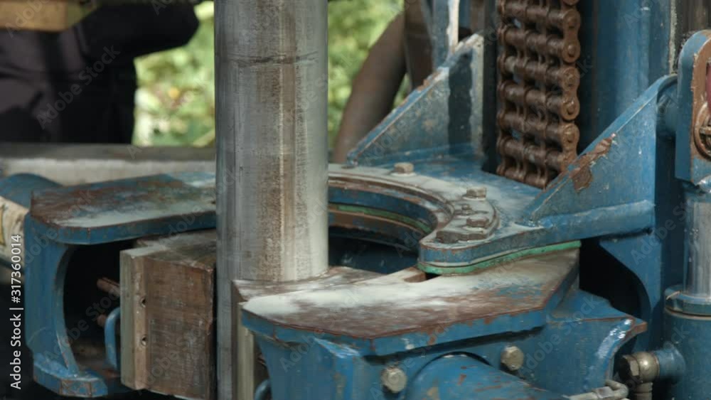 Drilling rig pulling out drill pipe after boring a geothermal borehole Drilling rig pulling out drill pipe after boring a geothermal borehole