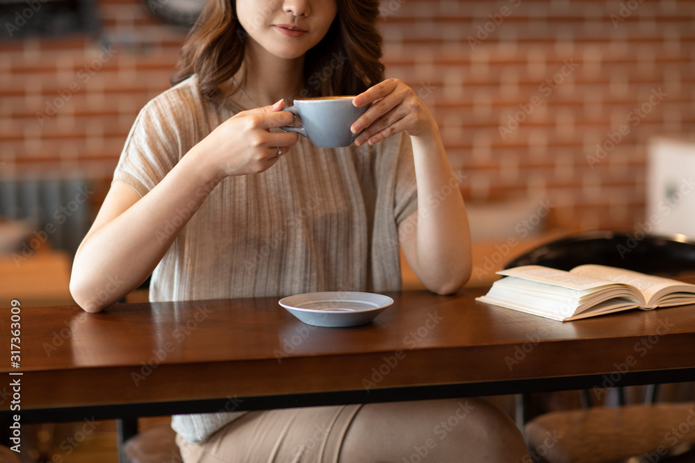 Elegant woman reading book in cafe Elegant woman reading book in cafe